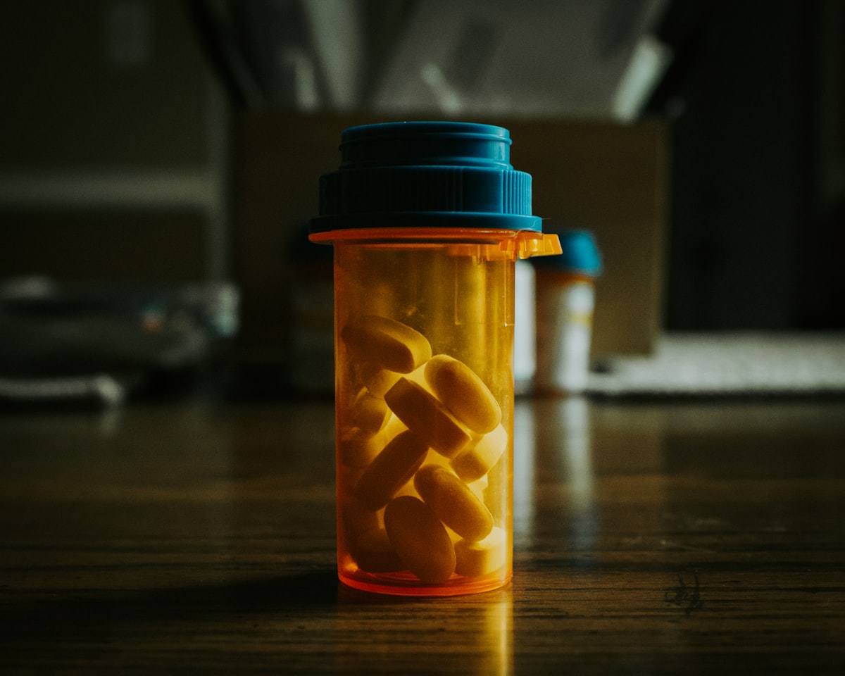Prescription medicine bottle on a wooden table