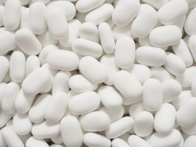 White oval medication pills on a table