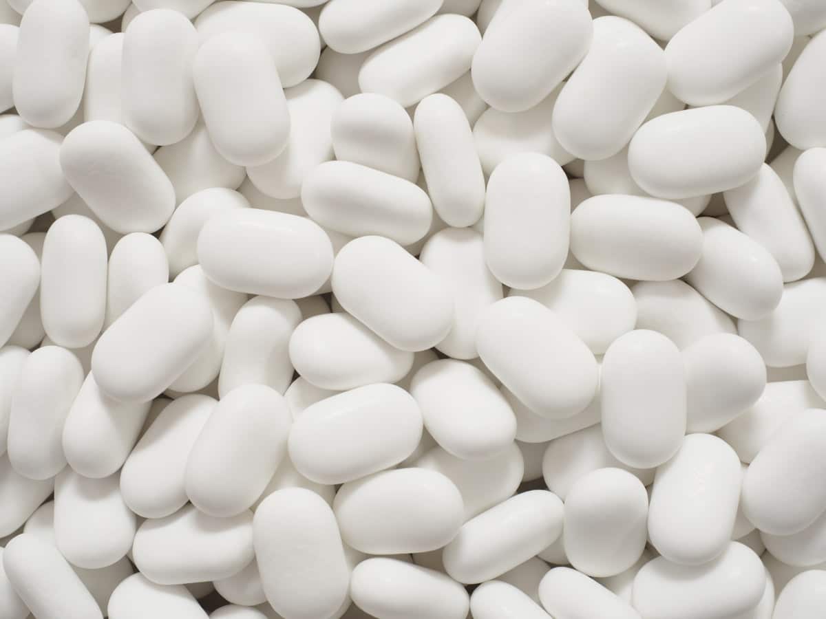 White oval medication pills on a table