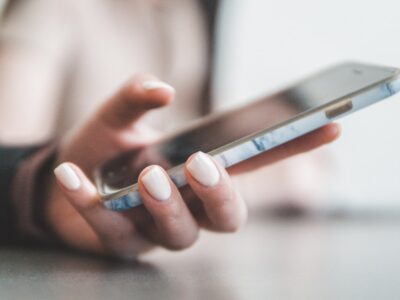 Hand holding a phone to make a call