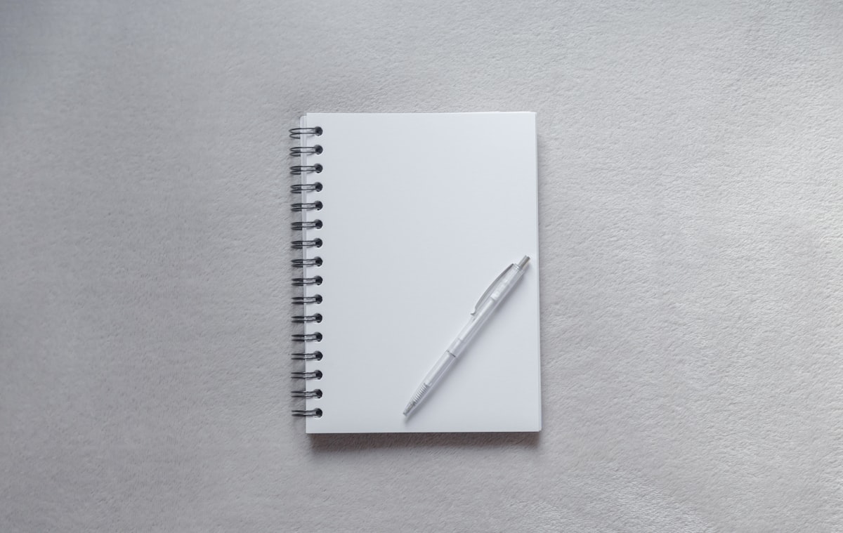 White notebook and pen ready for notes