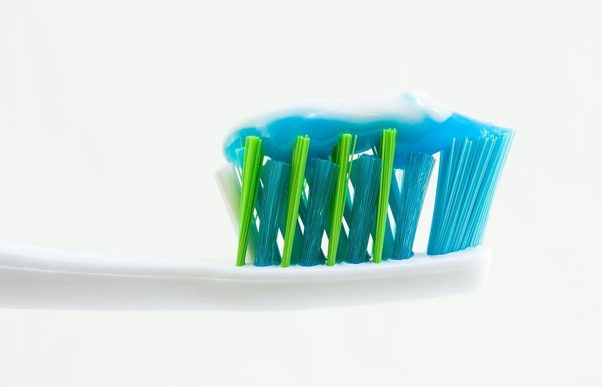Toothbrush with toothpaste on the bristles, part of keeping whitening results